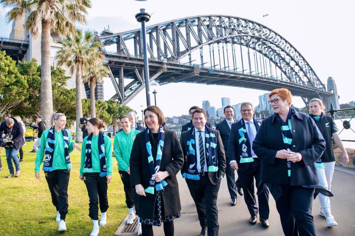 Group photo of attendees following the press conference under the Sydney Harbour Bridge.