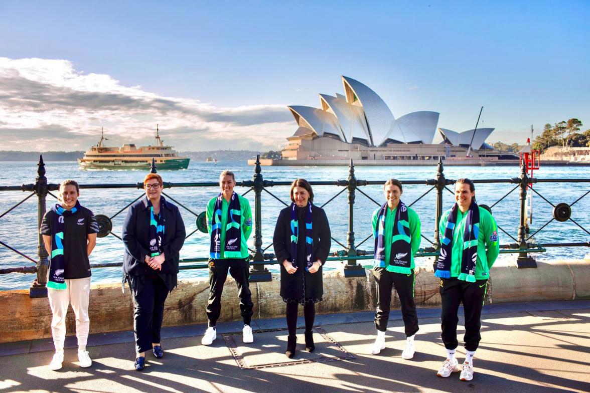 Group photo of attendees following a press conference with the Sydney Harbour and Sydney Opera House in the background.