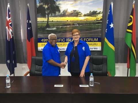 Australian Minister for Foreign Affairs, Senator the Hon Marise Payne shaking hands with the Prime Minister of Solomon Islands the Honourable Rick Houenipwela MP following the signing of a MoU between Australia and Solomon Islands on participating in the