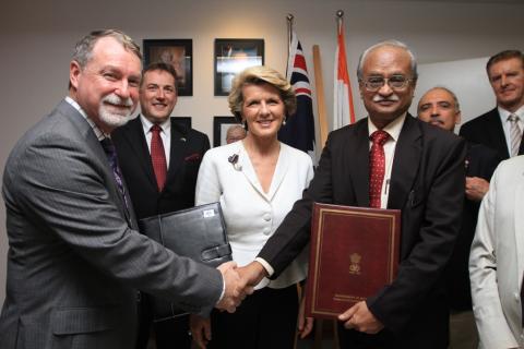 Foreign Minister Julie Bishop with Andrew Way of Alfred Health and Prof MC Misra of AIIMS after the MoU signing. 16 November 2013