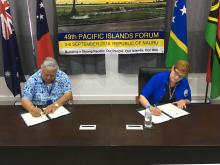 Australian Minister for Foreign Affairs, Senator the Hon Marise Payne and the Prime Minister of Samoa, the Hon Tuilaepa Sailele Malielegaoi signing two MoUs between Australia and Samoa on participating in the Pacific Medicines Testing Program and the Paci
